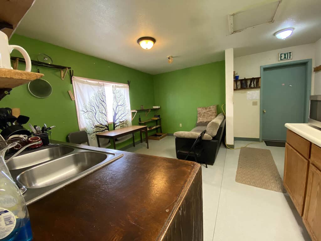 Small kitchen with a sofa in the living room