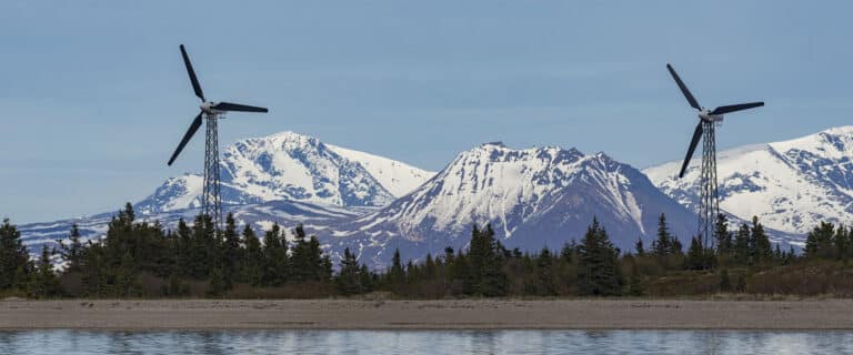 Wind mills with mountains in the background